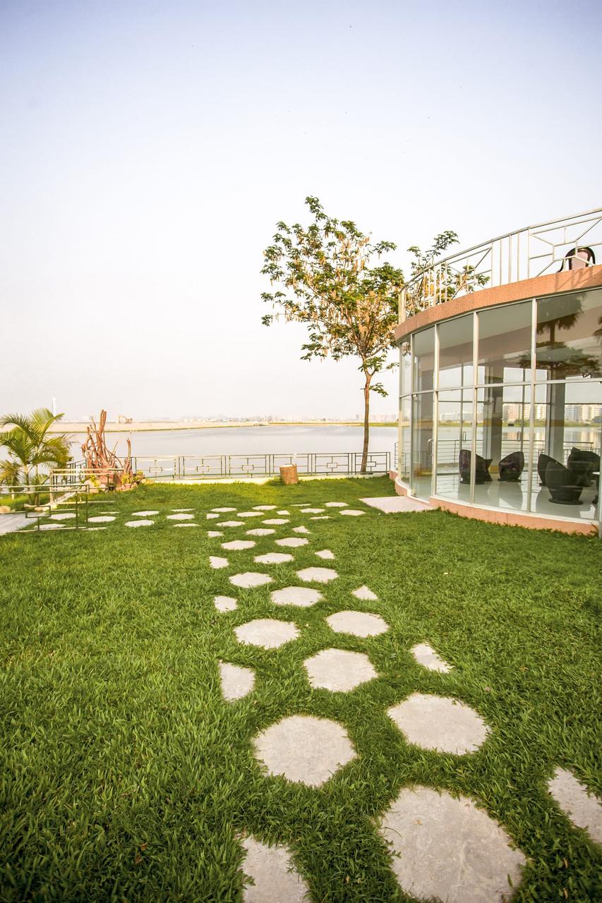 Jaljochora Party Center seen across the lawn with stepping-stone path